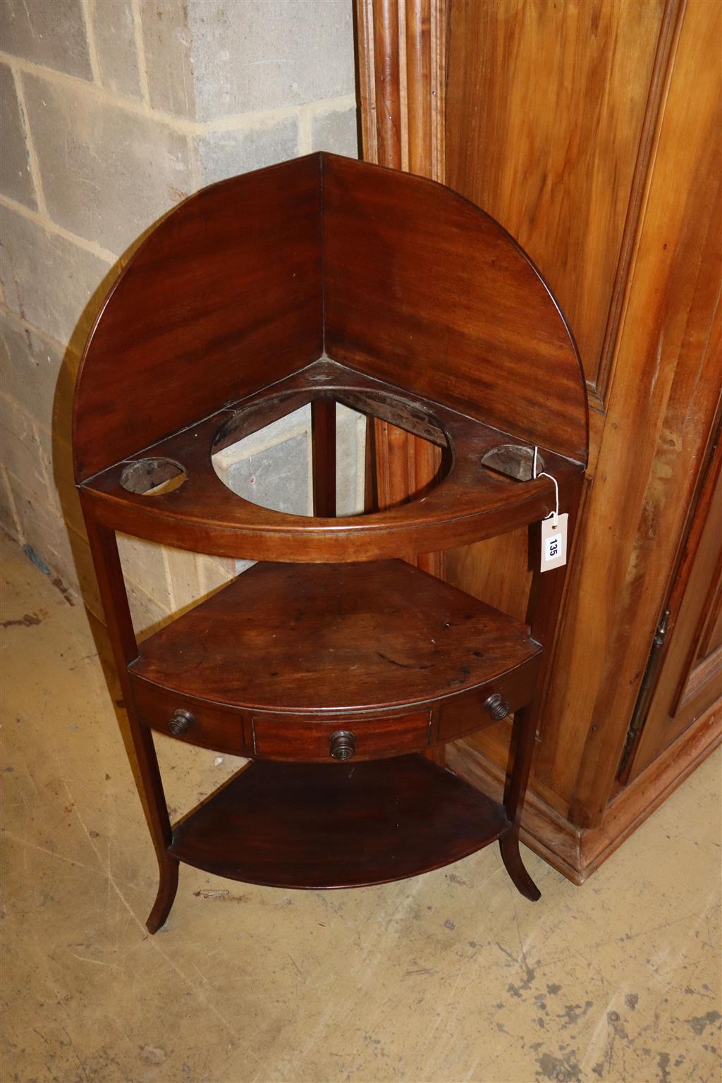 A George III mahogany corner washstand, width 58cm, depth 40cm, height 110cm